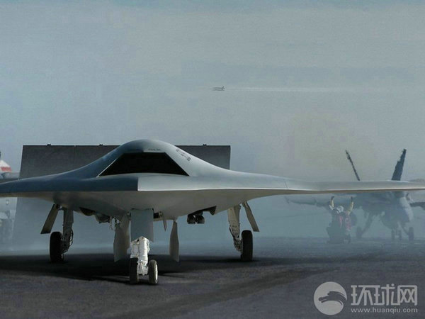 資料圖：X-47B無(wú)人機(jī)在航母上起降想象圖。